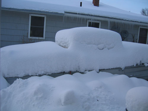 1960 Biscayne parts car under snow