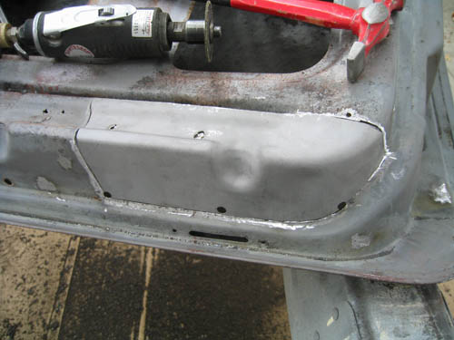 Rust cut out and patch fitted before being welded. Rust cut out and patch fitted before being welded.